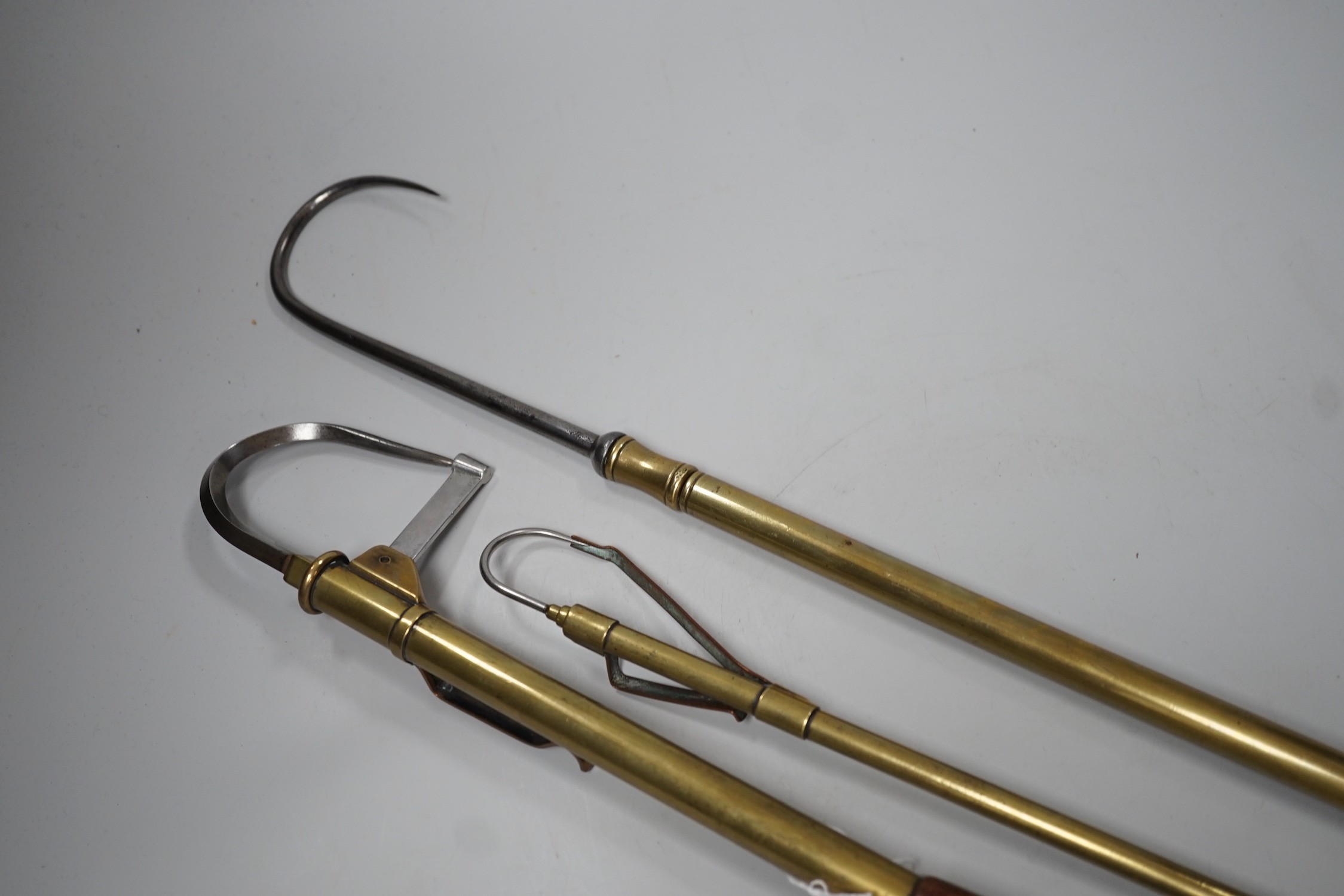 Three brass telescopic fishing gaffs